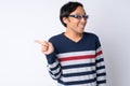 Portrait of happy Japanese man laughing while pointing finger Royalty Free Stock Photo