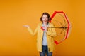 Studio shot of laughing carefree girl with umbrella enjoying good weather. Indoor portrait of dreamy caucasian woman in