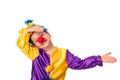 Studio shot of a little boy wearing carnival costume of a clown with a red round nose, isolate.