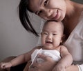 Studio shot of loving mother holding baby Royalty Free Stock Photo