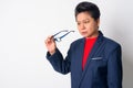 Portrait of mature Asian businesswoman checking eyeglasses