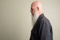 Profile view of mature bald man with long gray beard Royalty Free Stock Photo