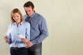 Studio Shot Of Middle Aged Couple Looking at Bills Royalty Free Stock Photo