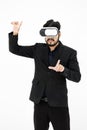Studio shot of Millennial Asian smart professional successful businessman ceo entrepreneur wearing virtual reality VR goggles Royalty Free Stock Photo