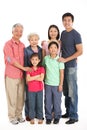 Studio Shot Of Multi-Generation Chinese Family Royalty Free Stock Photo