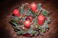 Advent wreath and two burning red candles on a wooden table Studio Royalty Free Stock Photo