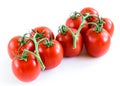 Studio shot organic a cluster of vine ripened Roma tomatoes isolated on white background Royalty Free Stock Photo