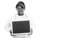Studio shot of overweight African woman doctor holding blackboard Royalty Free Stock Photo