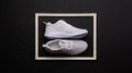 A studio shot of pair of running shoes on black background. Flat lay.