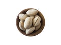 Studio shot of pecans on white background. Pecans in nutshell on wooden bowl isolated on white. Pecans with copy space for text. Royalty Free Stock Photo