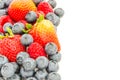 Studio shot pile of organic strawberries, blueberries and raspberries collection isolated on white Royalty Free Stock Photo