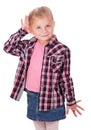 Studio shot portrait of thoughtful little girl who is eavesdropping. Copy space on white background. Royalty Free Stock Photo