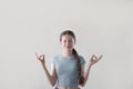 Studio Shot Of Relaxed Teenage Girl Meditating With Closed Eyes Royalty Free Stock Photo