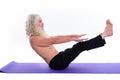 Studio shot of senior bearded guru man doing yoga poses and stretching Royalty Free Stock Photo