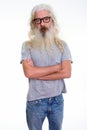 Studio shot of senior bearded man standing while wearing eyeglas