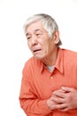 Senior Japanese man heart attack Royalty Free Stock Photo