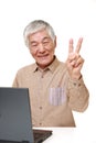 Senior Japanese  man using laptop computer Royalty Free Stock Photo