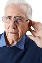 Studio Shot Of Senior Man Suffering From Deafness Royalty Free Stock Photo