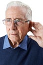 Studio Shot Of Senior Man Suffering From Deafness Royalty Free Stock Photo