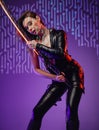 Sensual cyberpunk woman assassin posing with sword Royalty Free Stock Photo