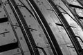 Studio shot of a set of summer car tires on black background. Tire stack background. Car tyre protector close up. Black rubber tir Royalty Free Stock Photo