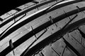 Studio shot of a set of summer car tires on black background. Tire stack background. Car tyre protector close up. Black rubber tir Royalty Free Stock Photo