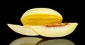 Studio shot of sliced Canary melon isolated black Royalty Free Stock Photo