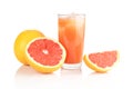 Studio shot sliced three grapefruits with juice isolated white