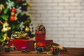 Studio shot of small and big red paper wrapped present gift boxes with gold and silver ribbon bow tie placed on wood table with Royalty Free Stock Photo