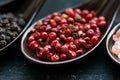 Close up pink peppercorn in spoon dark background Royalty Free Stock Photo