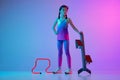 Studio shot of sportive girl, junior jogger in stylish sportswear and cap posing with sports equipment isolated on Royalty Free Stock Photo