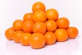 Stack of citrus tankan against white background