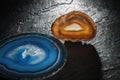 Blue and brown agate slices on slate