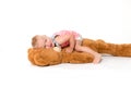 Toddler girl is lying on a big plush toy Royalty Free Stock Photo