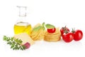 Studio shot of tomatoes,pasta,basil and cheese on white Royalty Free Stock Photo
