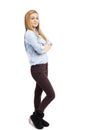 Studio shot of a trendy beautiful teenage girl with arms folded Royalty Free Stock Photo