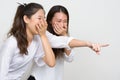 Two young beautiful Asian women as friends laughing together Royalty Free Stock Photo