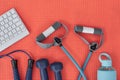 Hustle for that muscle. Studio shot of a variety of workout equipment and a keyboard on a red yoga mat.