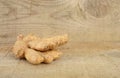 Studio shot of whole ginger isolated on wooden table