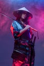 Woman samurai in cyberpunk style with katana