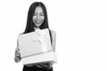 Studio shot of young happy Asian teenage girl smiling while opening gift box Royalty Free Stock Photo