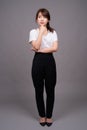 Full length shot of young Asian woman standing Royalty Free Stock Photo