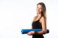 Studio shot of young beautiful teenage girl holding yoga mat and posing ready for gym Royalty Free Stock Photo