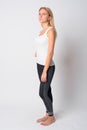 Full body shot profile view of young blonde woman ready for gym Royalty Free Stock Photo