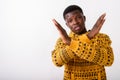Studio shot of young black African man showing stop hand gesture Royalty Free Stock Photo