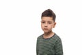 Studio shot of a young boy with a serious sad look, isolated Royalty Free Stock Photo