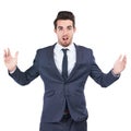 Thats way more than I bargained for. Studio shot of a young businessman looking surprised against a white background.