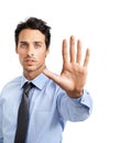 Stop right there. Studio shot of a young businessman showing a stop gesture. Royalty Free Stock Photo