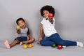 Young cute African siblings together against gray background Royalty Free Stock Photo