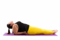 Studio shot of young fat Asian woman lying down and doing yoga p Royalty Free Stock Photo